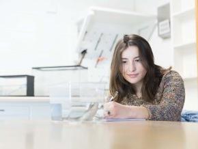 Maggie Keller sits in a lab